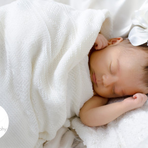New Born Baby on her mum’s wedding dress New Born Baby on her mum's wedding dress