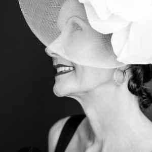 Lady with a white fascinator by Sumico Photography Lady with a white fascinator by Sumico Photography